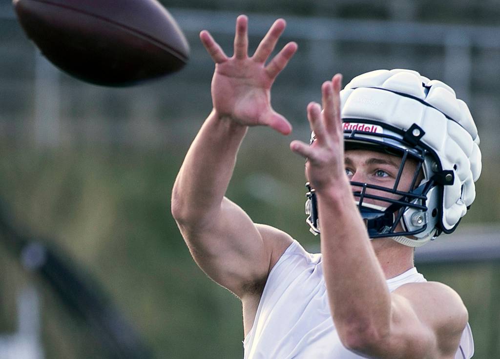 Evan Mannes eyes the incoming pass during practice at Glacier Peak High School in Snohomish on Oct. 4. (Kevin Clark / The Herald)
