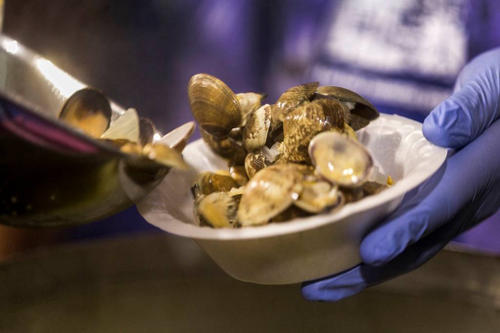 Steamed clams are served at the Mukilteo Boys & Girls Club during the 49th Annual Luau & Auction in Mukilteo on Sept. 30. (Kevin Clark / The Herald)
