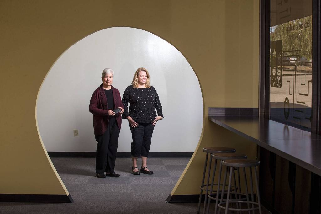 Executive Director Diane Kamionka (left) stands with Program Director Lara Merriam-Smith of the Northwest Innovation Resource Center in the Lab@Everett on Sept. 24 in Everett. (Andy Bronson / The Herald)