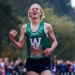Woodinville senior Luke Houser smiles Saturday after setting a meet record at the Hole in the Wall Invitational at Lakewood High School in Arlington. (Olivia Vanni / The Herald)