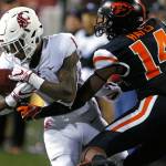 Washington States Tay Martin (1) makes a catch in front of Oregon States Kaleb Hayes during the fourth quarter of a game on Oct. 6, 2018, in Corvallis, Ore. (AP Photo/Timothy J. Gonzalez)
