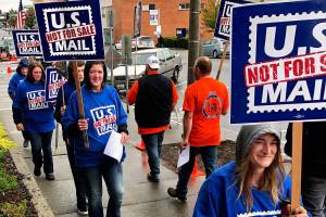 Postal workers and other supportive union members take part in an informational picket in downtown Everett Monday. They oppose possible privatization of the U.S. Postal Service, which is being explored by the Trump administration. (Photo Bob James)