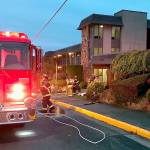 Off-duty fire chaplain helps woman escape from condo flames