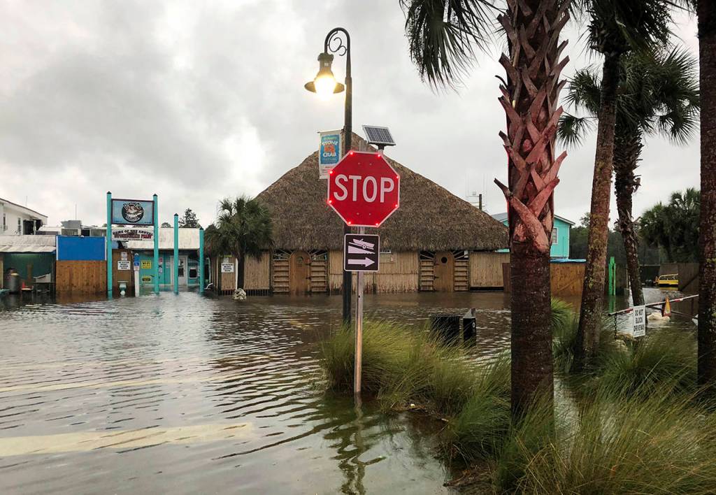 The St. Marks River overflows into the city of St. Marks, Florida, ahead of Hurricane Michael on Wednesday. The hurricane center says Michael will be the first Category 4 hurricane to make landfall on the Florida Panhandle. (AP Photo/Brendan Farrington)