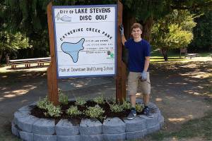 Boy Scout rehabilitates disc golf sign for Eagle project