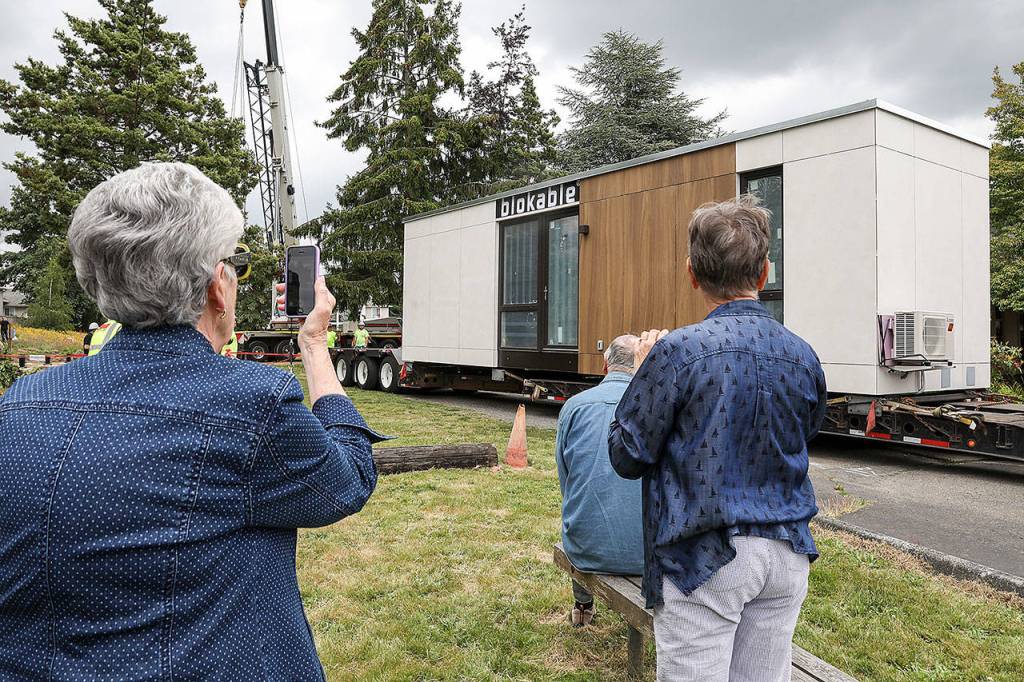 Parishioners at the Edmonds Lutheran Church greeted the Blok unit when it arrived in late June. The church is partnering with Compass Housing Alliance to build low-income housing on its property. (Lizz Giordano / The Herald)