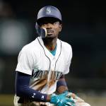 The Mariners Dee Gordon sits on the field after being tagged out at first against the Orioles during a game on Sept. 4, 2018, in Seattle. (AP Photo/John Froschauer)