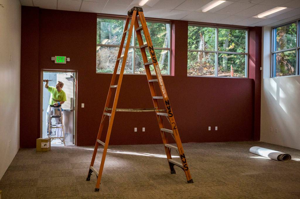 A painter puts the finishing touches in the teen room at <a href="https://www.heraldnet.com/news/colossal-mukilteo-club-18000-square-feet-for-3000-youths/" target="_blank">the new Mukilteo Boys & Girls Club</a> on Oct. 3. (Olivia Vanni / The Herald)