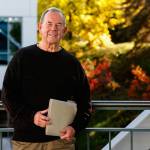 Everett historian Larry ODonnell carries a folder of photos and words he has compiled while writing a biography of Victor Sumio Hirakawa, a Japanese-American member of his Everett High School class of 1955. (Dan Bates / Herald Photographer)