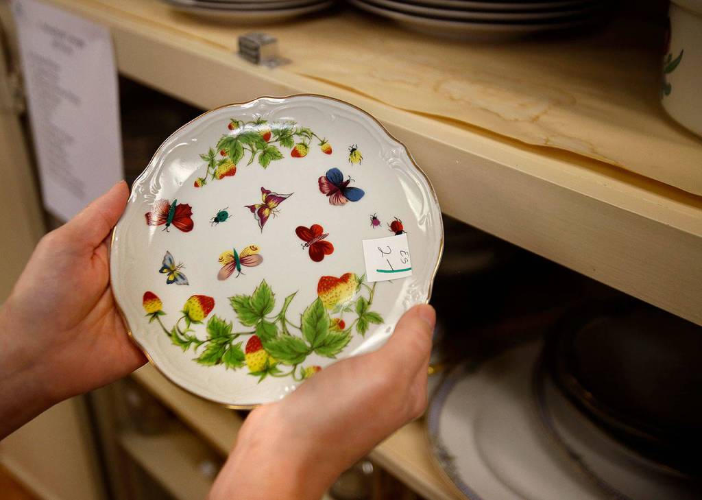 Vintage plates and cups with butterflies are among the selections in the Jackson house sale. These were favorites of Helen Jackson, who died in February. (Dan Bates / The Herald)