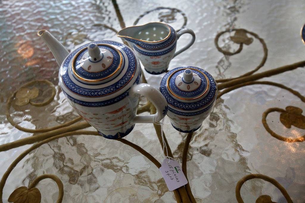 A Chinese tea set, from Anna Marie Laurences great-grandparents, features translucent leaf-shaped patterns visible when light strikes. (Dan Bates / The Herald)