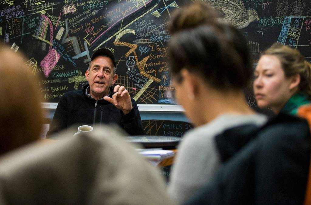 Steve Jones, director at The Bread Lab, talks with graduate students from Tufts University as they spend their spring break learning about bread making. (Andy Bronson / The Herald)