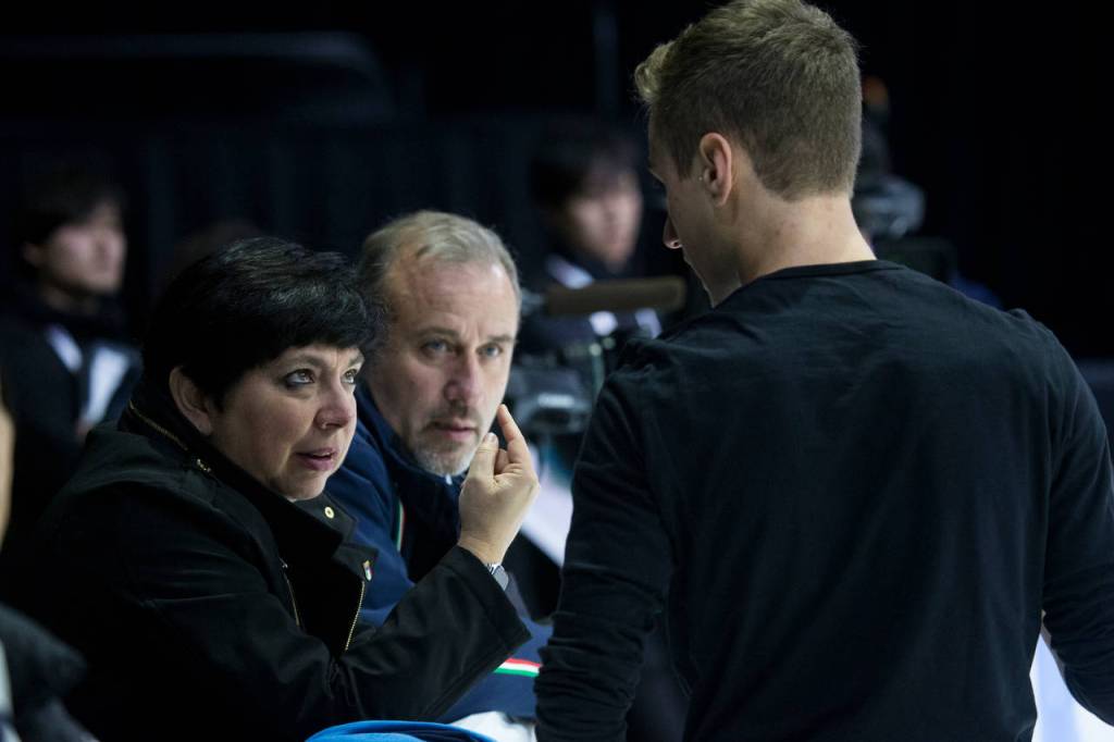 Skater Matteo Rizzo gets advice from his coach, Franca Bianconi, during practice before the 2018 Skate America competition at Angel of the Winds Arena on Thursday in Everett. (Andy Bronson / The Herald)