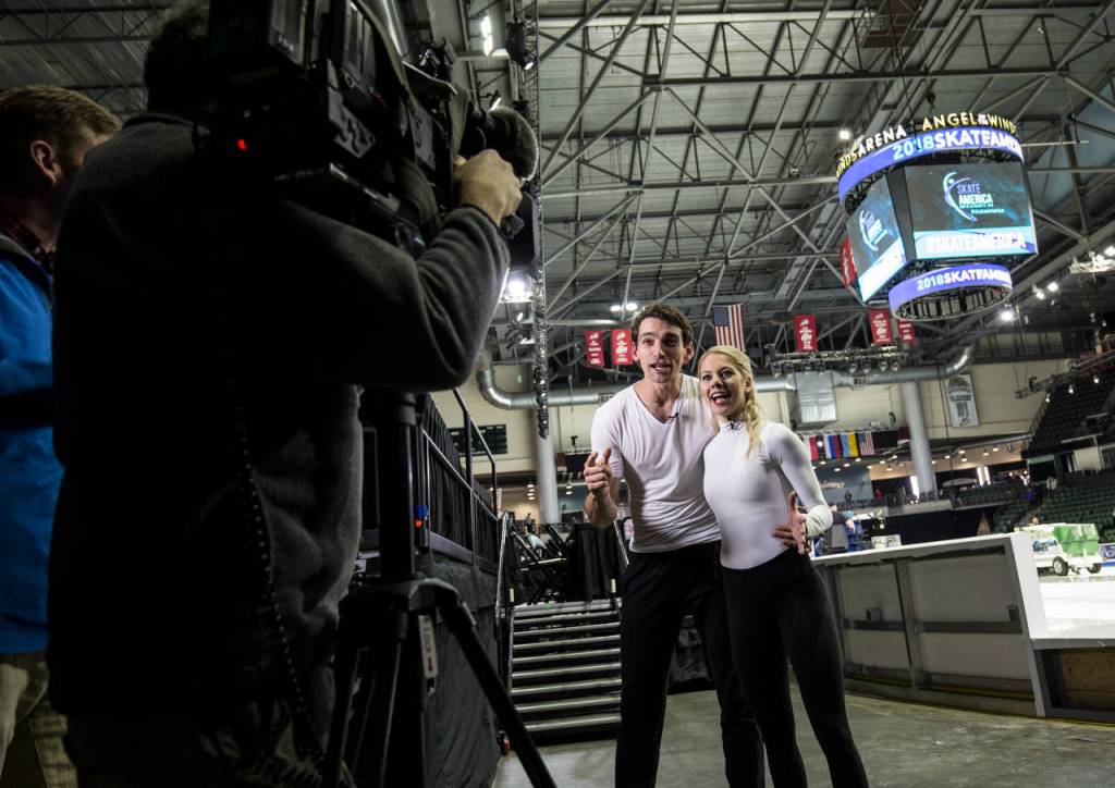 Skaters Alexa Scimeca Knierim and Chris Knierim (USA) record a promotion for the local Evening Magazine TV show after practice at the 2018 Skate America competition at Angel of the Winds Arena on Thursday in Everett. (Andy Bronson / The Herald)