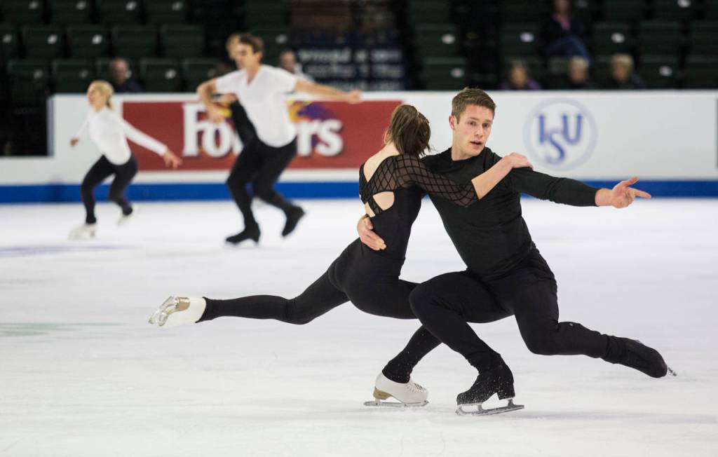 Pairs skaters Evelyn Walsh and Trennt Michaud (Canada) practice before the 2018 Skate America competition at Angel of the Winds Arena on Thursday in Everett. (Andy Bronson / The Herald)