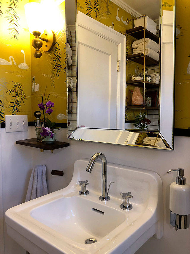 Instead of spending hundreds on a new sink, we refinished an antique sink they purchased to go with the bathrooms new aesthetic. (Aaron Swaney)
