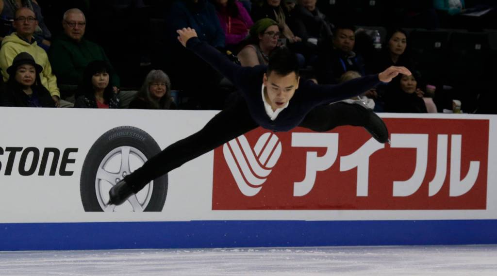 Nam Nguyen of Canada leaps at the 2018 Skate America competition Friday at Angel of the Winds Arena in Everett. (Andy Bronson / The Herald)