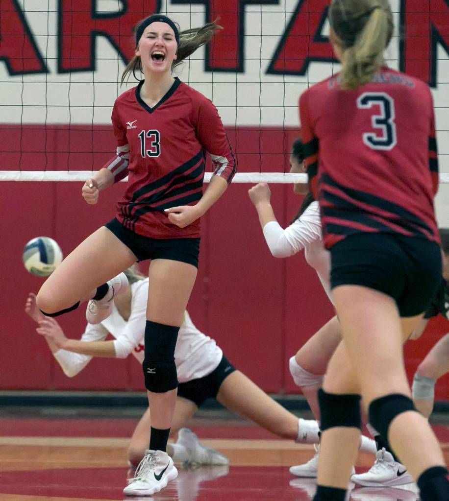 Snohomishs MacKenzie Whyte celebrates a kill Thursday night against Stanwood on Oct. 18 at Stanwood High School. (Kevin Clark / The Herald)