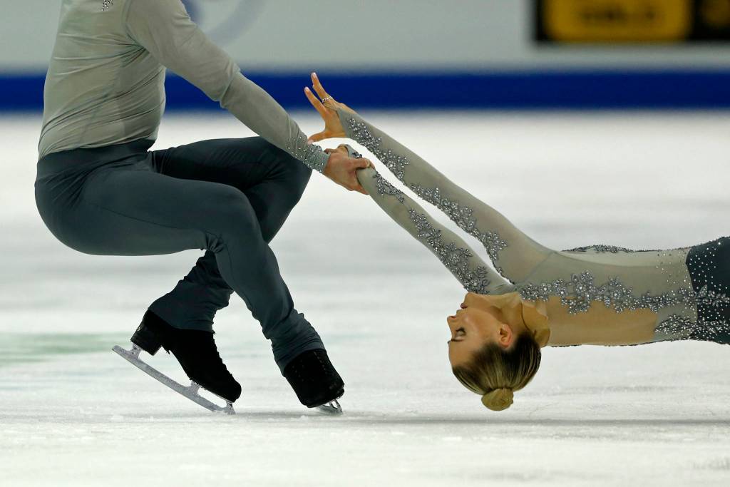Ashley Cain is spun by her partner Timothy Leduc during the paris free skating program at the 2018 Skate America competition on Saturday at Angel of the Winds Arena in Everett. (Olivia Vanni / The Herald)