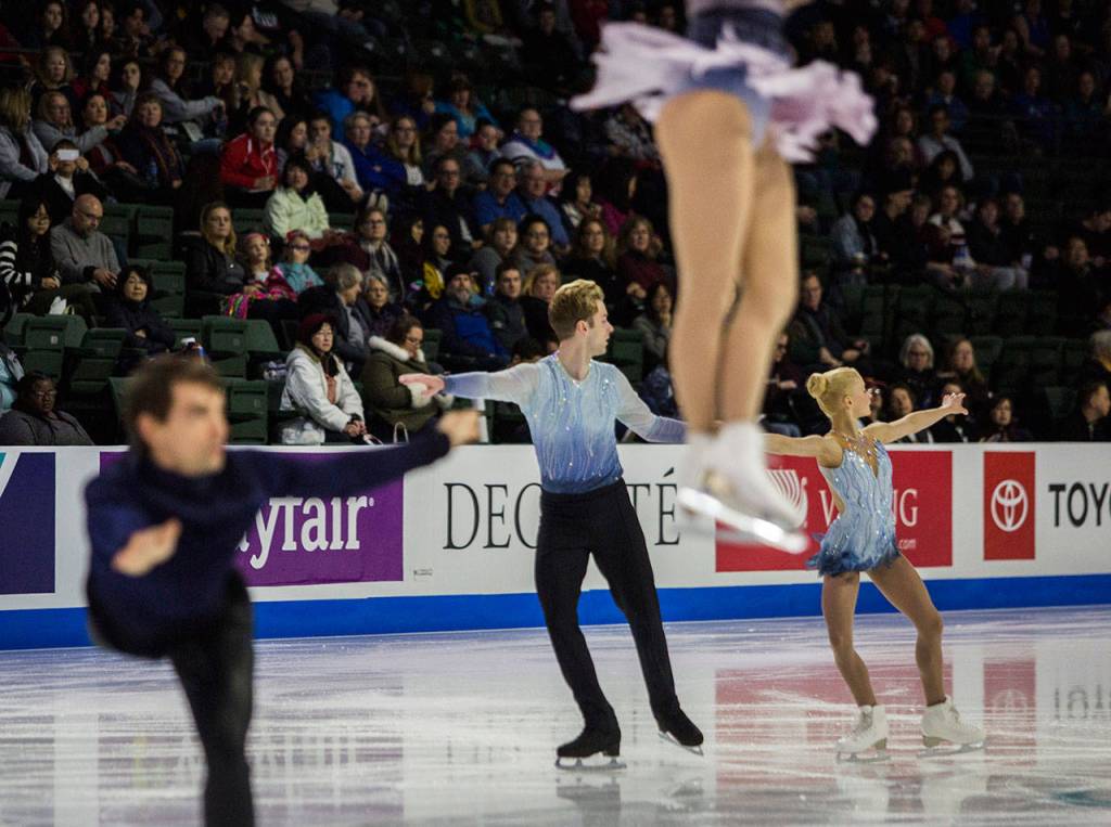 Nica Digerness and Danny Neudecker warm up before the pairs free skating program at Skate America, Friday, Oct. 19, 2018, in Everett, Wash. (Olivia Vanni / The Herald)