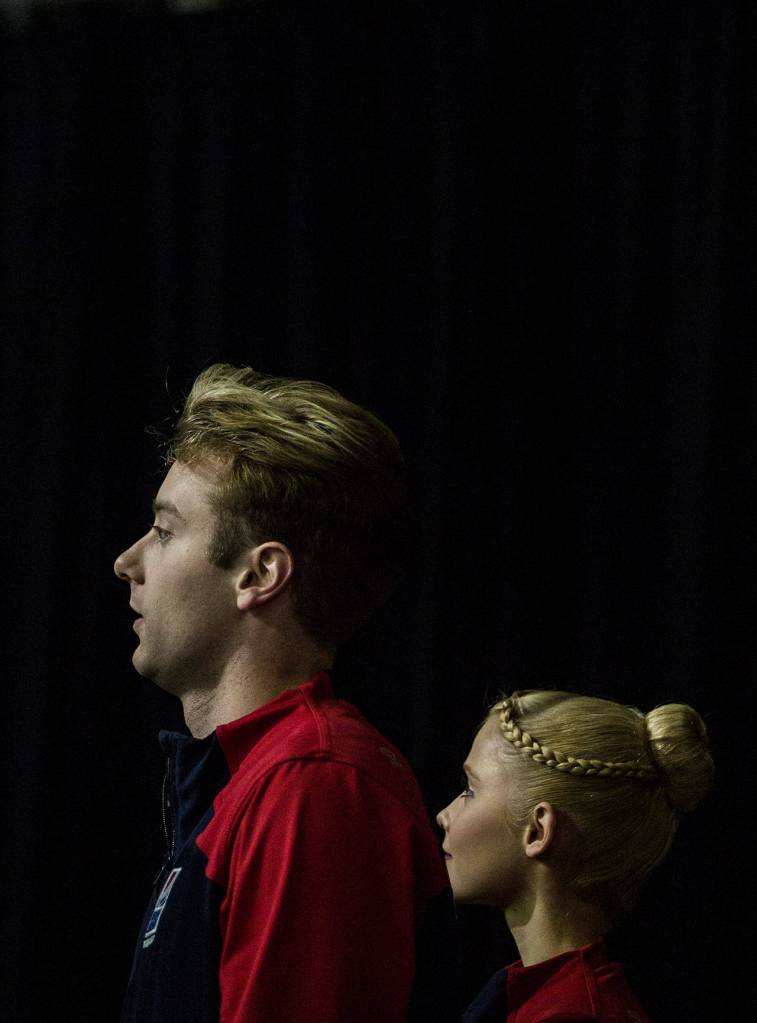 Nica Digerness and Danny Neudecker before the pairs free skating program at the 2018 Skate America competition on Saturday at Angel of the Winds Arena in Everett. (Olivia Vanni / The Herald)