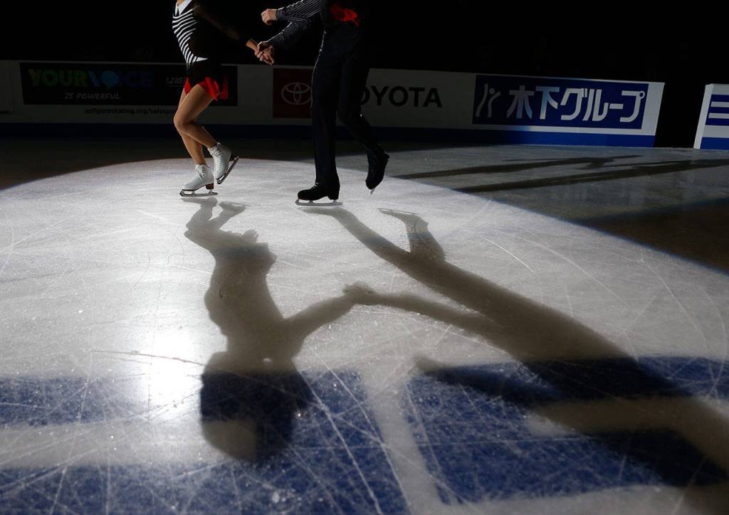 Alisa Efimova and Alexander Karolin step onto the ice for the medal ceremony at the 2018 Skate America competition on Saturday at Angel of the Winds Arena in Everett. (Olivia Vanni / The Herald)