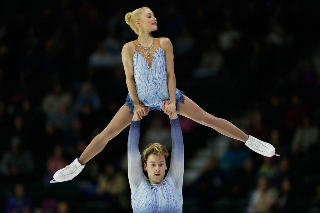 Nica Digerness and Danny Neudecker perform a lift during the pairs free skating program at Skate America, Friday, Oct. 19, 2018, in Everett, Wash. (Olivia Vanni / The Herald)