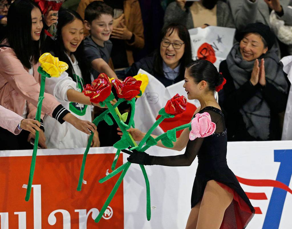 Satoko Miyahara accepts gifts from fans after her ladies free skate program at the 2018 Skate America competition on Sunday at Angel of the Winds Arena in Everett. (Olivia Vanni / The Herald)