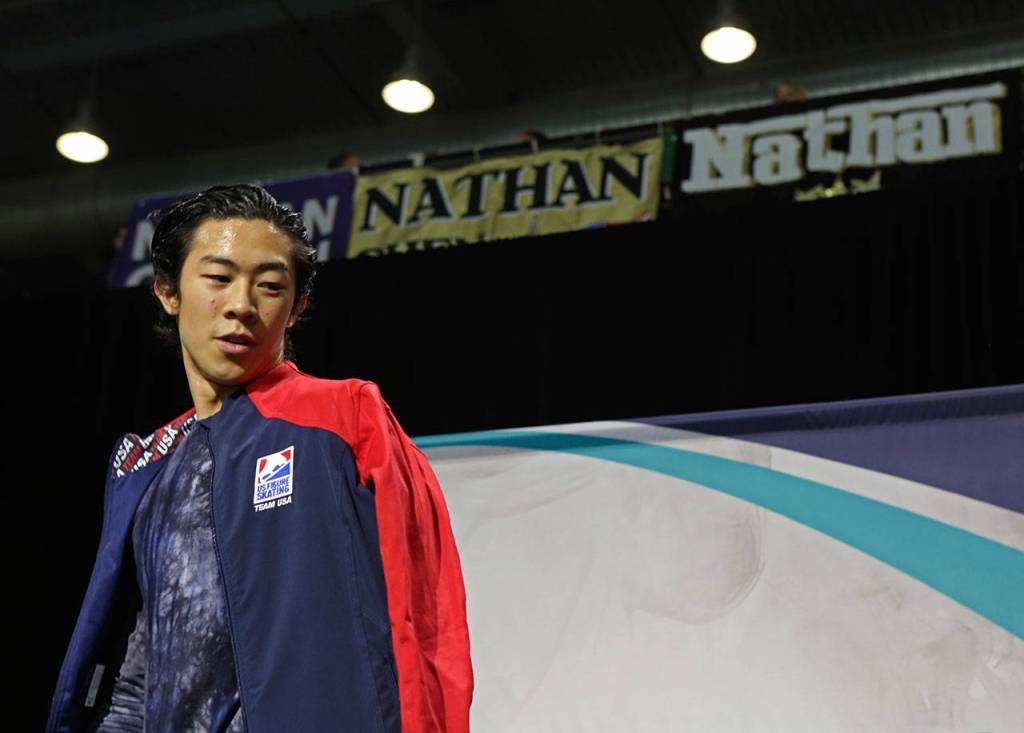 Nathan Chen leaves the media area after receiving a first place score at the 2018 Skate America competition on Saturday at Angel of the Winds Arena in Everett. (Olivia Vanni / The Herald)