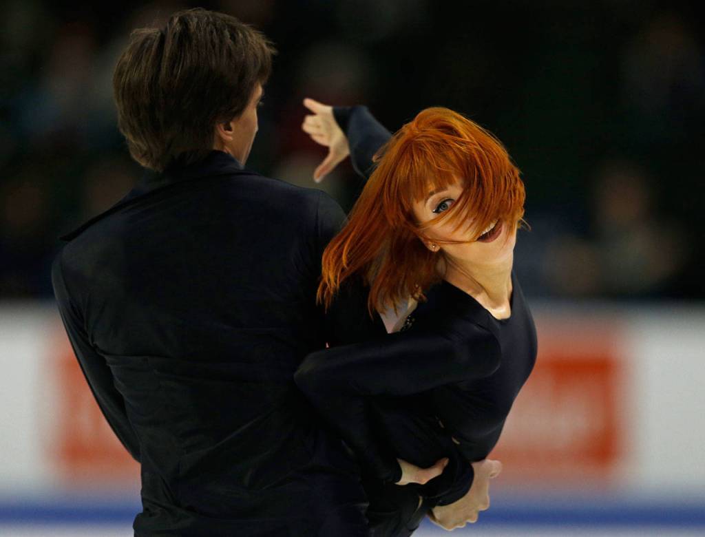 Tiffani Zagorski and Jonathan Guerreiro perform a lift during their free dance program at the 2018 Skate America competition on Sunday at Angel of the Winds Arena in Everett. (Olivia Vanni / The Herald)