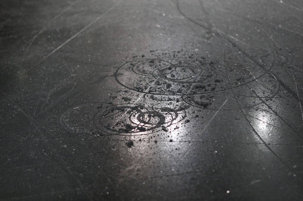 Carved up ice during the medal ceremony at the 2018 Skate America competition on Sunday at Angel of the Winds Arena in Everett. (Olivia Vanni / The Herald)