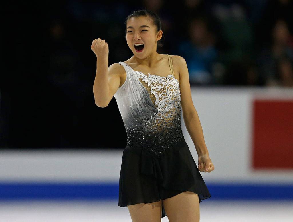 Kaori Sakamoto raises a fist in the air after skating a clean ladies free skate program at the 2018 Skate America competition on Sunday at Angel of the Winds Arena in Everett. (Olivia Vanni / The Herald)