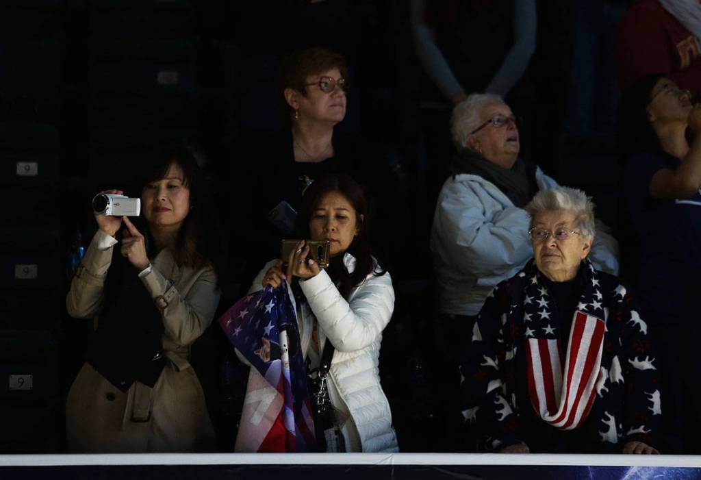 Spectators during the national anthem at the 2018 Skate America competition on Saturday at Angel of the Winds Arena in Everett. (Olivia Vanni / The Herald)