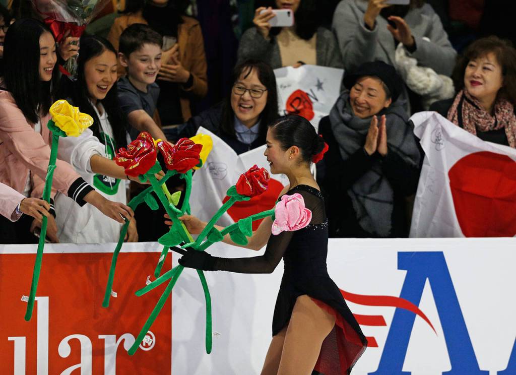 Satoko Miyahara accepts gifts from her fans after her ladies free skate program at the 2018 Skate America competition on Sunday at Angel of the Winds Arena in Everett. (Olivia Vanni / The Herald)
