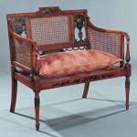 Caned arms, back and seat make this settee a little different. It was made in the 19th century in the Adam taste. Neal Auction Co. in New Orleans sold it for $1,250. (Cowles Syndicate Inc.)