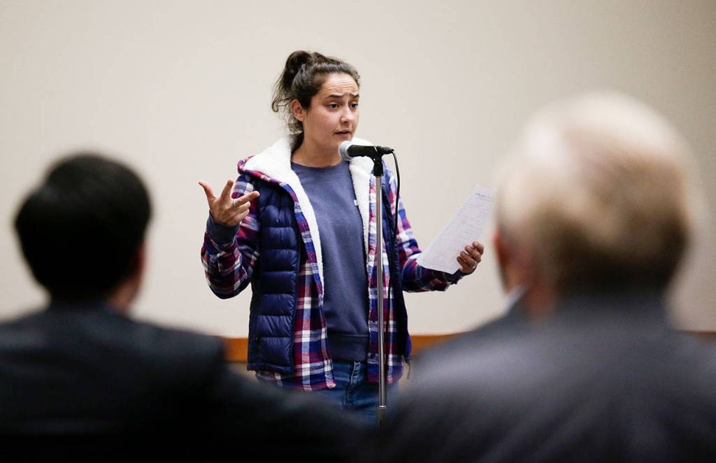 Kristina Melnichen explains the reasons she thinks Paine Field study results are flawed during a Federal Aviation Administration hearing at the Lynnwood Convention Center on Monday. (Andy Bronson / The Herald)