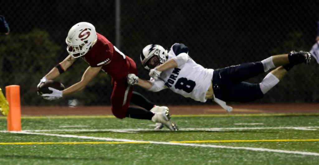 Squalicums Declan McGhee (right) tackles Snohomishs Tyler Massena just short of the end zone during the Panthers 30-27 win Fridayat Veterans Memorial Stadium in Snohomish. (Andy Bronson / The Herald)