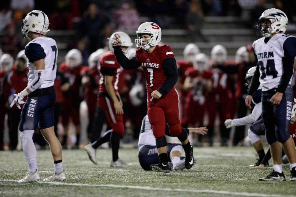 Snohomishs Kyler Hammer (7) raises a fist after kicking a field goal during the Panthers 30-27 win over Squalicum Friday night at Veterans Memorial Stadium in Snohomish. (Andy Bronson / The Herald)