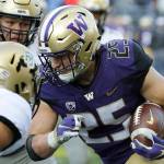 Washington linebacker Ben Burr-Kirven (25) runs after intercepting a pass during the second half of a game against Colorado on Oct. 20, 2018, in Seattle. Washington won 27-13. (AP Photo/Ted S. Warren)