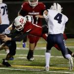 Snohomish quarterback Tayte Conover dives in for a touchdown during the Panthers 30-27 win over Squalicum on Friday night at Veterans Memorial Stadium in Snohomish. (Andy Bronson / The Herald)