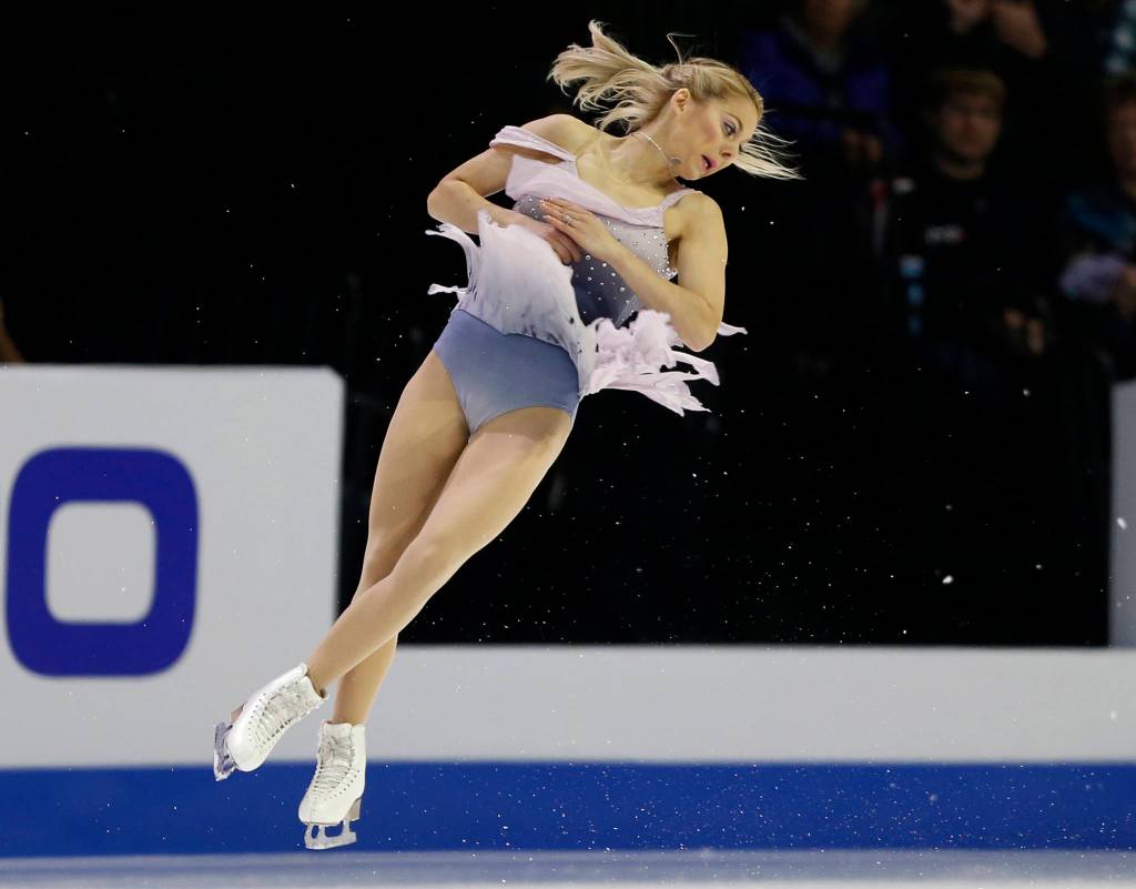 Alexa Scimeca Knierim twists in the air during the pairs free skating program at the 2018 Skate America competition at Angel of the Winds Arena in Everett. (Olivia Vanni / The Herald)
