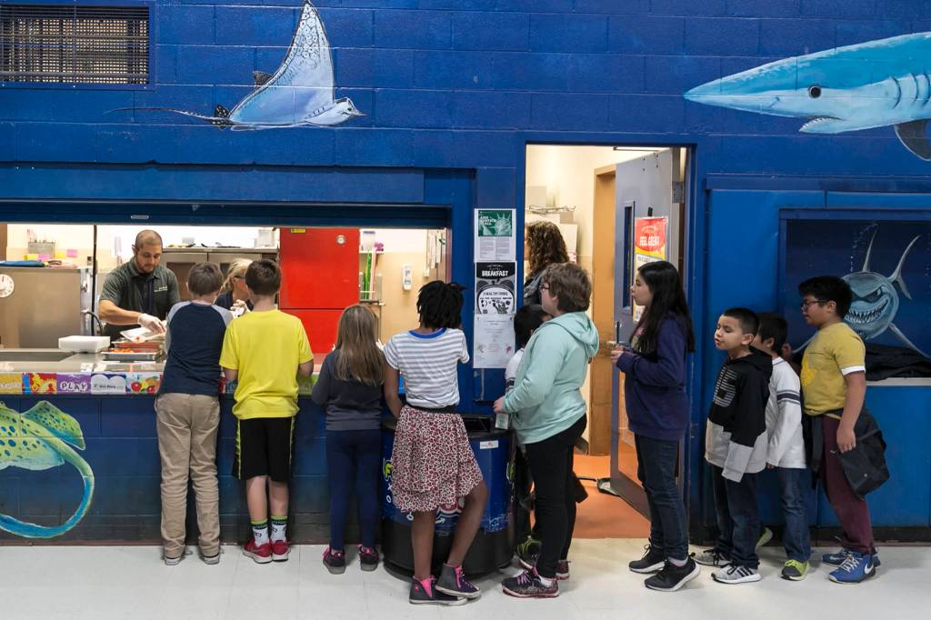 Students line up for meals at Shoultes Elementary School in Marysville on Oct. 24. (Kevin Clark / The Herald)