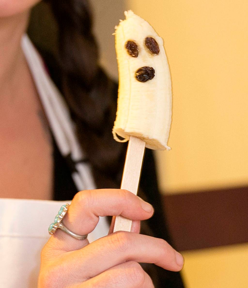 Anne Meinke <a href="https://www.heraldnet.com/life/healthy-halloween-lynnwood-mom-on-making-good-for-you-treats/" target="_blank">makes boo-nanas</a> at home in Lynnwood on Oct. 23. (Kevin Clark / The Herald)
