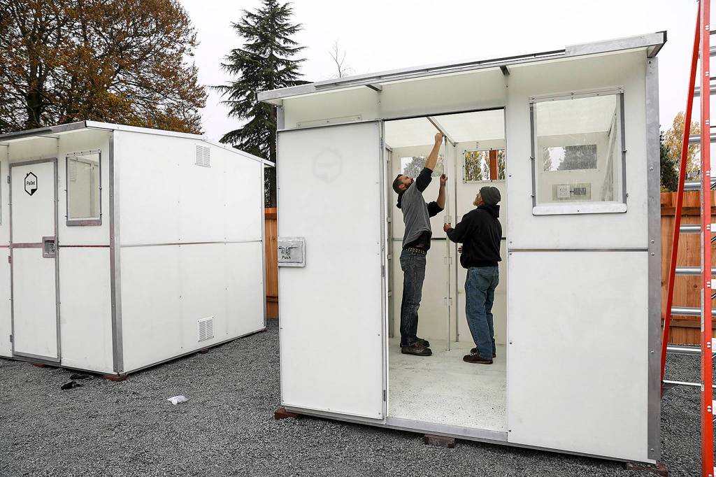 Six tiny homes <a href="https://www.heraldnet.com/news/first-authorized-tiny-home-village-opens-in-snohomish-county/" target="_blank">were installed</a> on the grounds of Good Shepherd Baptist Church in Lynnwood on Oct. 25. (Lizz Giordano / The Herald)