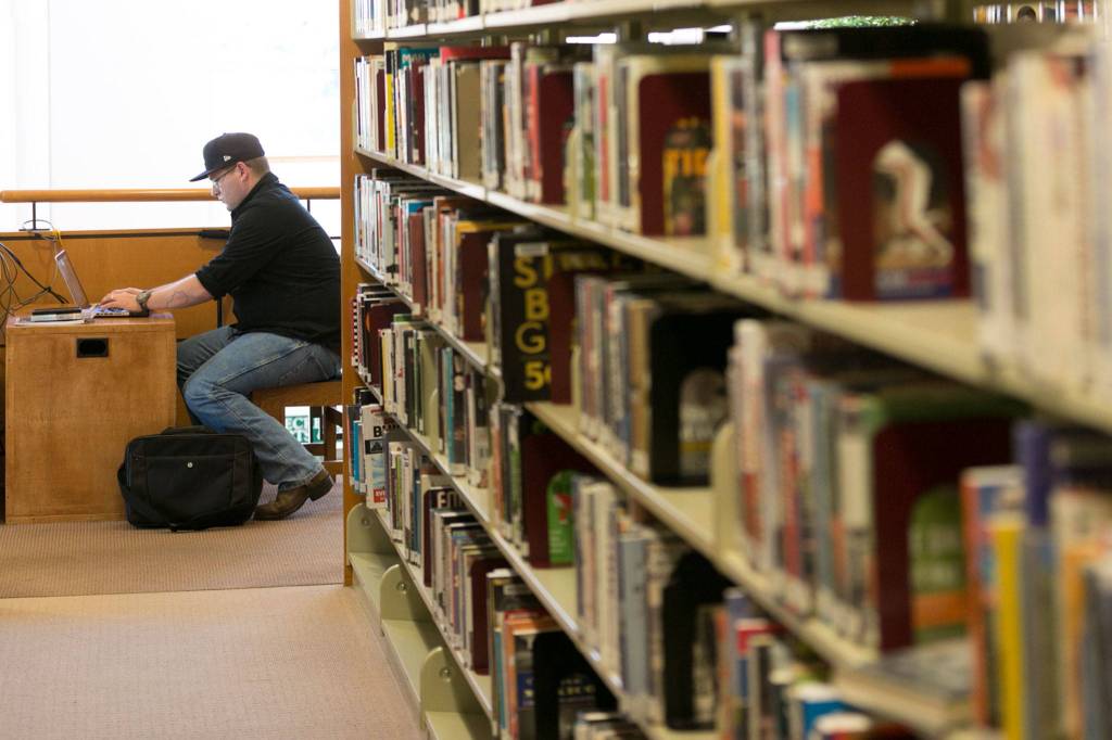 Eric Lancaster of Everett is participating in National Novel Writing Month in November. (Kevin Clark / The Herald)
