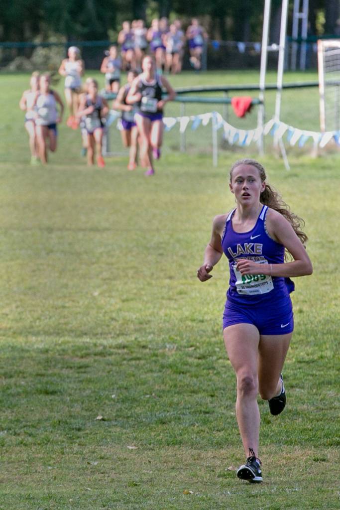 Lake Stevens senior Taylor Roe leads the pack on her way to a first-place finish at the 4A Northwest District Girls Cross Country Championships on Oct. 27, 2018, at South Whidbey High School in Langley. (Kevin Clark / The Herald)