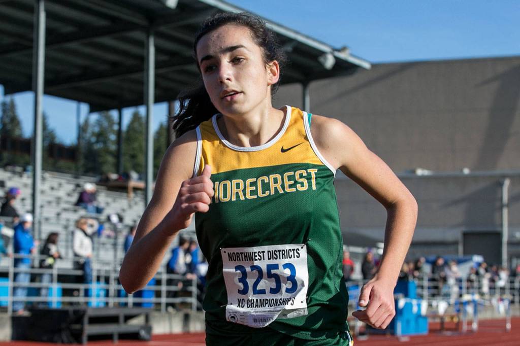 Shorecrest senior Lillian Visser finishes first in the 3A Northwest District Girls Championships on Oct. 27, 2018, at South Whidbey High School in Langley. (Kevin Clark / The Herald)