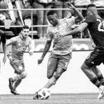 Bettina Hansen / The Seattle Times via AP                                Seattle Sounders defender Kelvin Leerdam (center) maneuvers around San Jose Earthquakes midfielder Anibal Godoy in the first half of an MLS soccer game Sunday in Seattle.