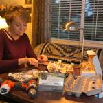 Caralee Hudson works on her ornaments at her home in Lynnwood. (Kevin Clark / The Herald)