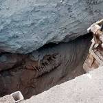 Orange metal plates spanning a lane on Broadway in Everett are covering voids like this one, discovered during the Wetmore Avenue emergency bypass project. All that remained of the original wooden pipe were the metal rings that surrounded it. (City of Everett)